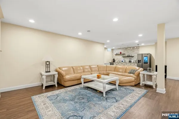 a living room with furniture and a rug