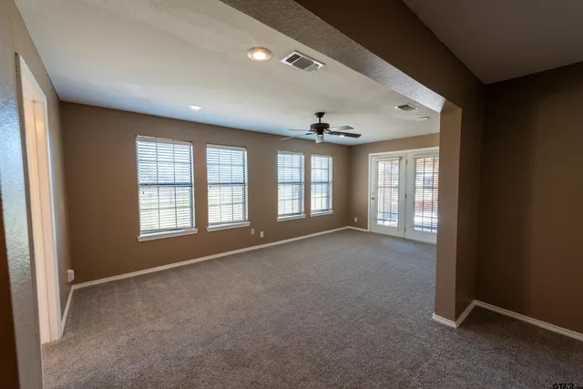 a bathroom with a bathtub sink and mirror