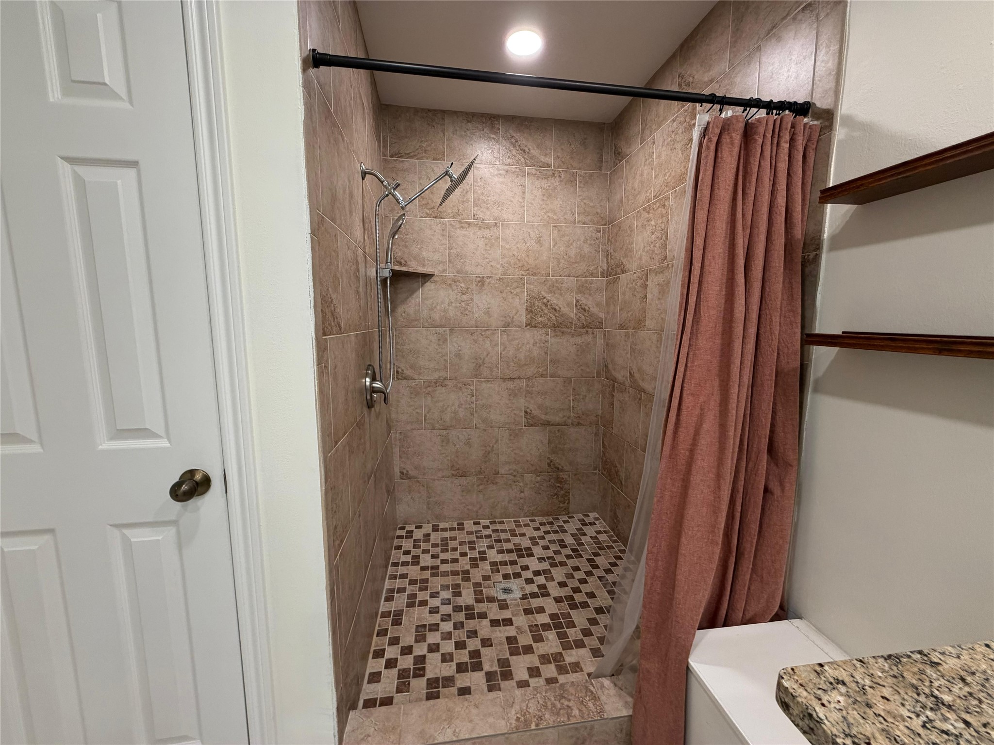 7818 King Arthur Court Spring, TX 77379 - Photo 14 of 29 a bathroom with a shower and a sink