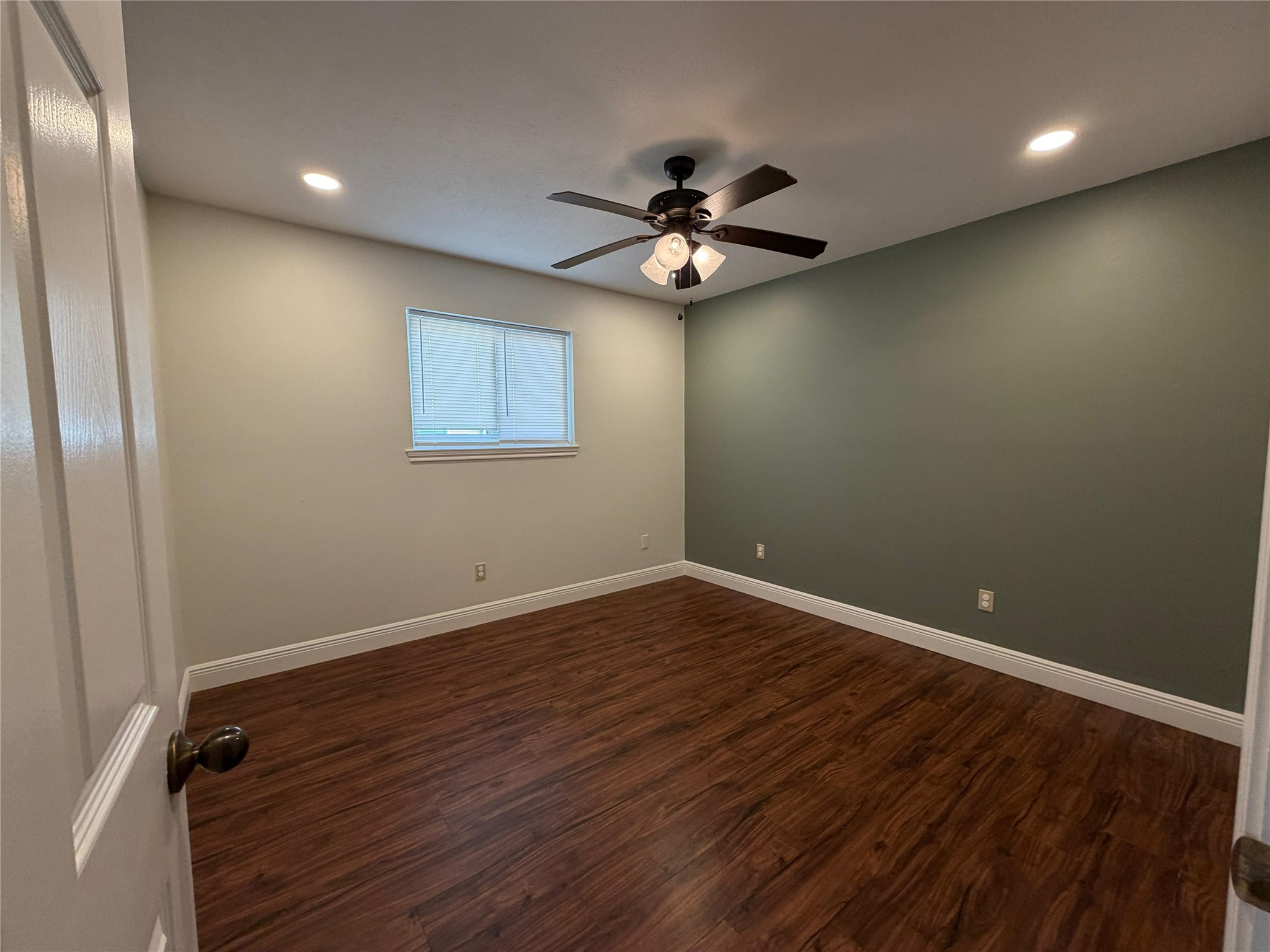 7818 King Arthur Court Spring, TX 77379 - Photo 23 of 29 an empty room with a window and a fan