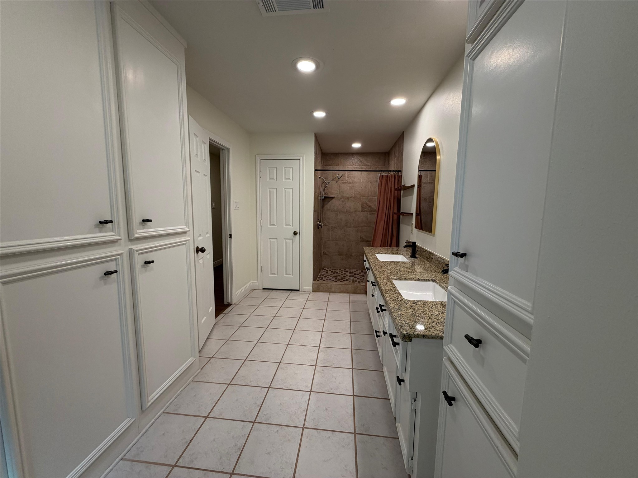 7818 King Arthur Court Spring, TX 77379 - Photo 7 of 29 a bathroom with a sink a toilet and mirror