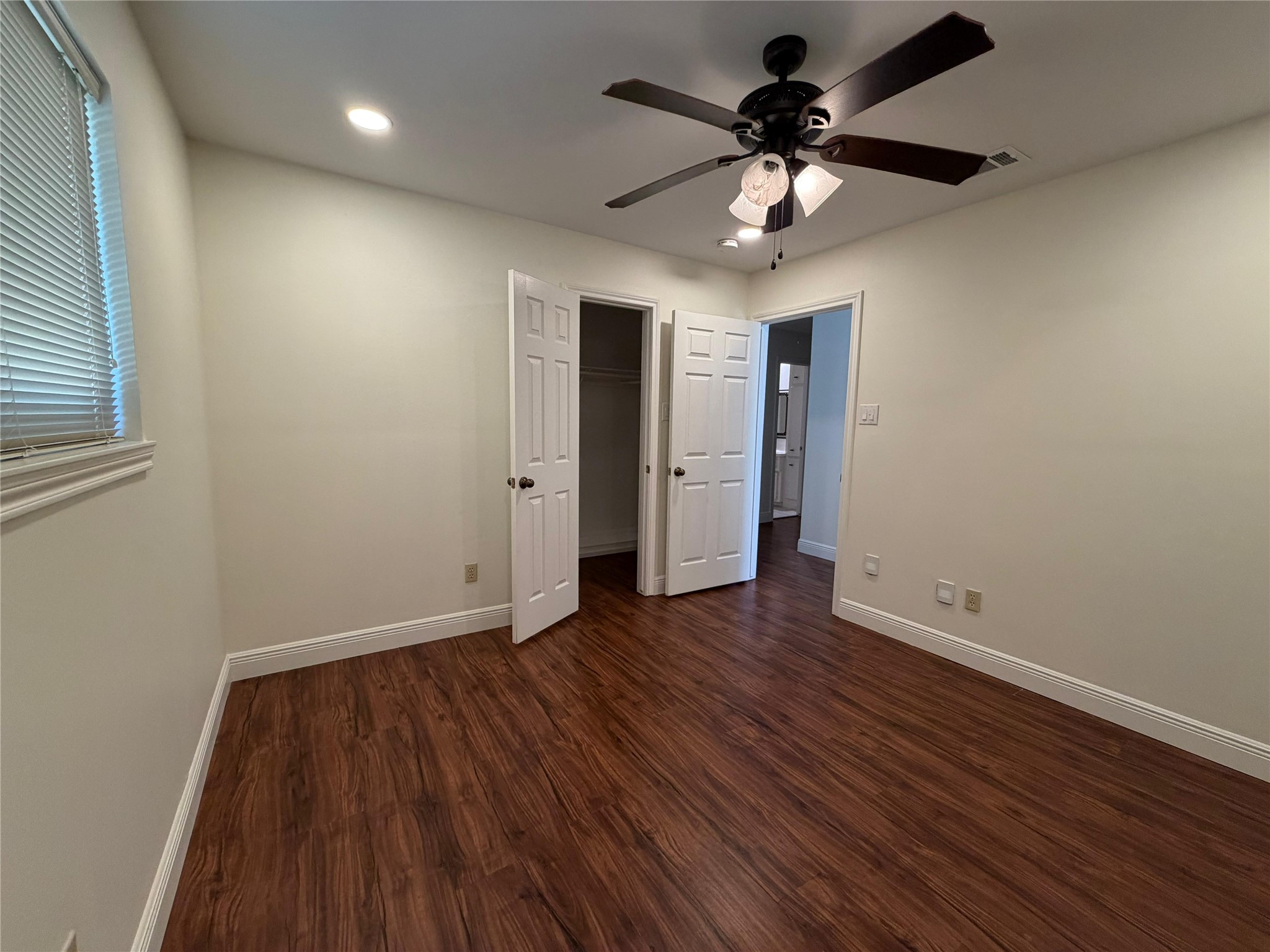 7818 King Arthur Court Spring, TX 77379 - Photo 10 of 29 a view of an empty room with wooden floor