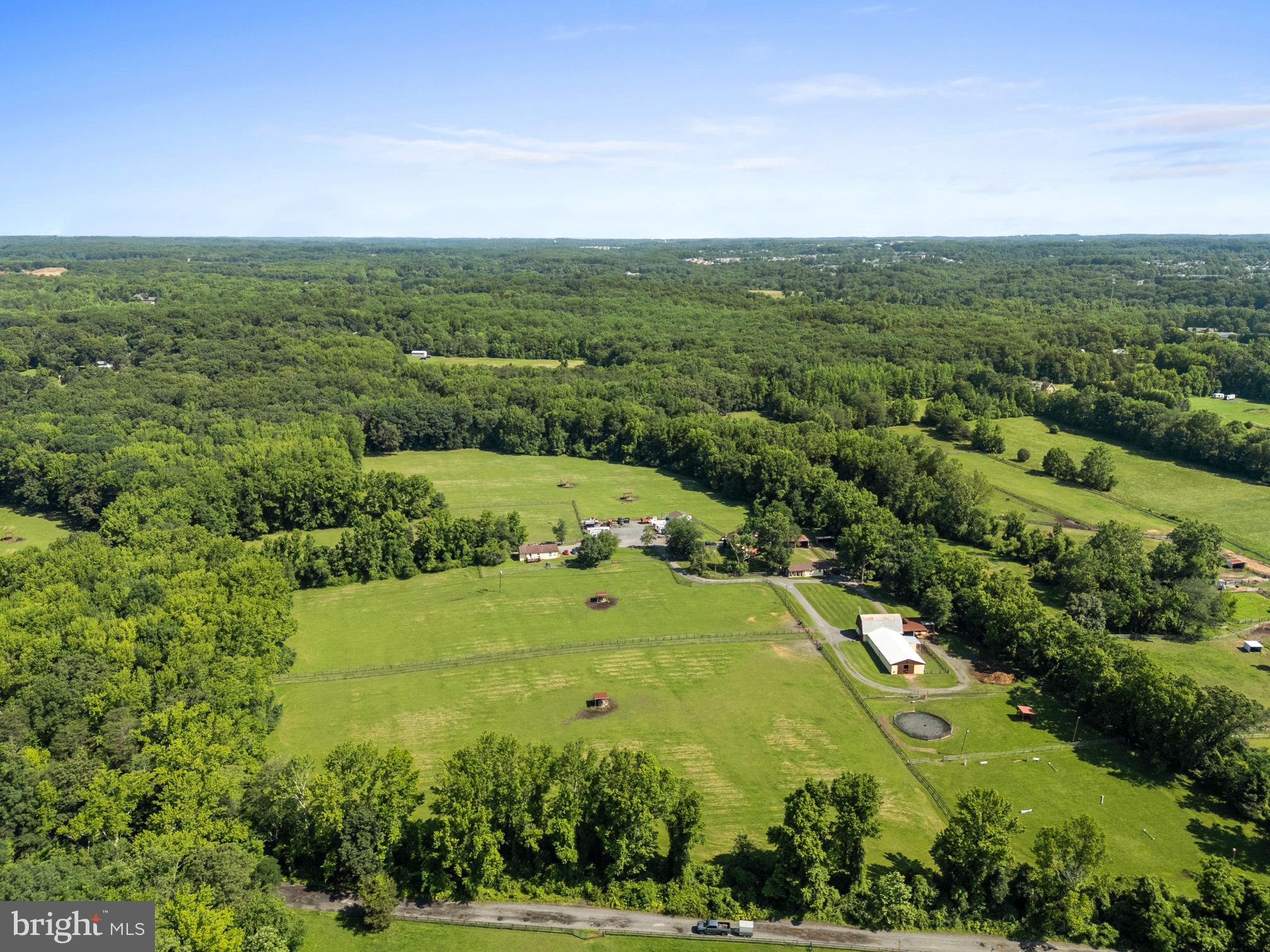 3613 Clayton Road Joppa, MD 21085 - Photo 20 of 27 an aerial view of green landscape with trees houses and mountain view