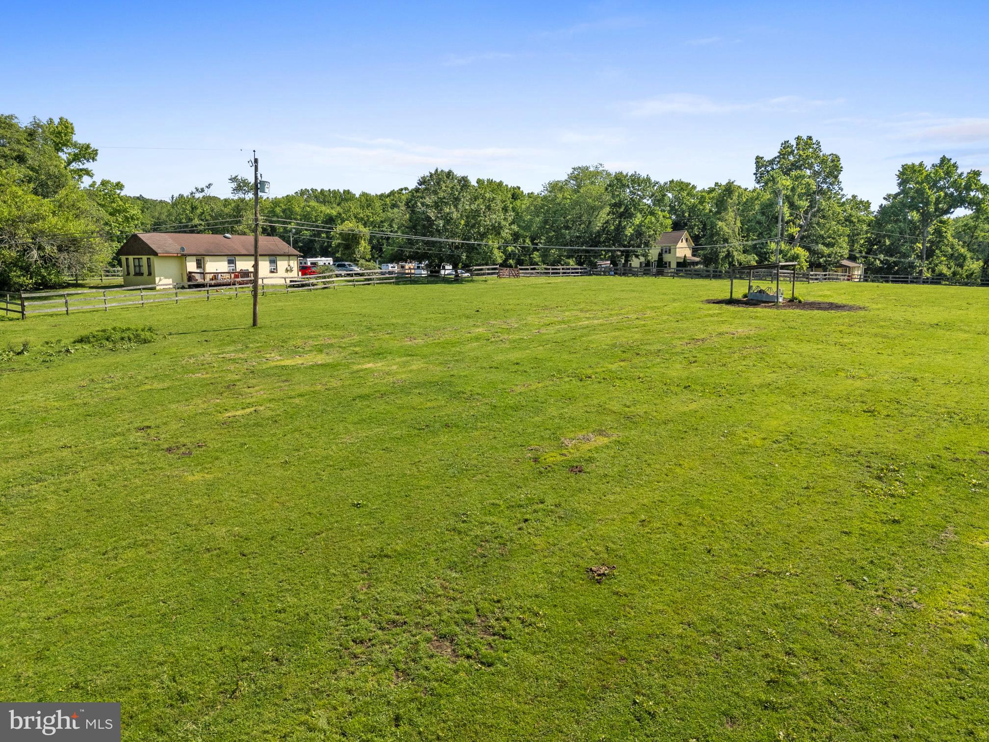 3613 Clayton Road Joppa, MD 21085 - Photo 25 of 27 a view of a green field with trees in the background