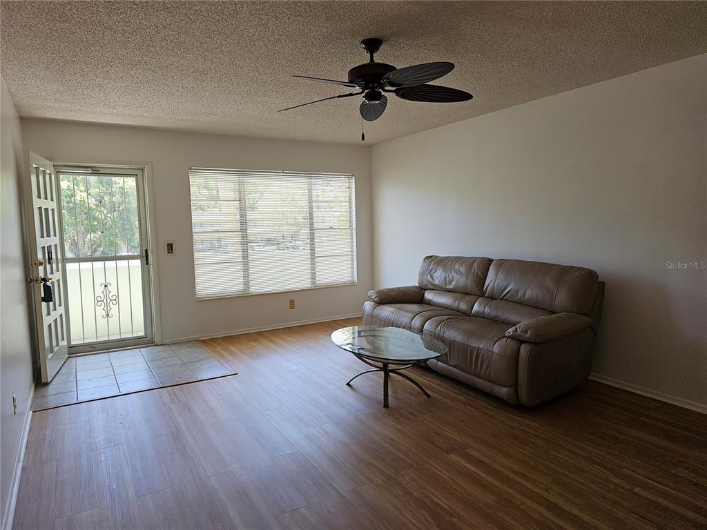 2386 Sumatran Way, Unit 44 Clearwater, FL 33763 - Photo 11 of 67 a living room with furniture and a window