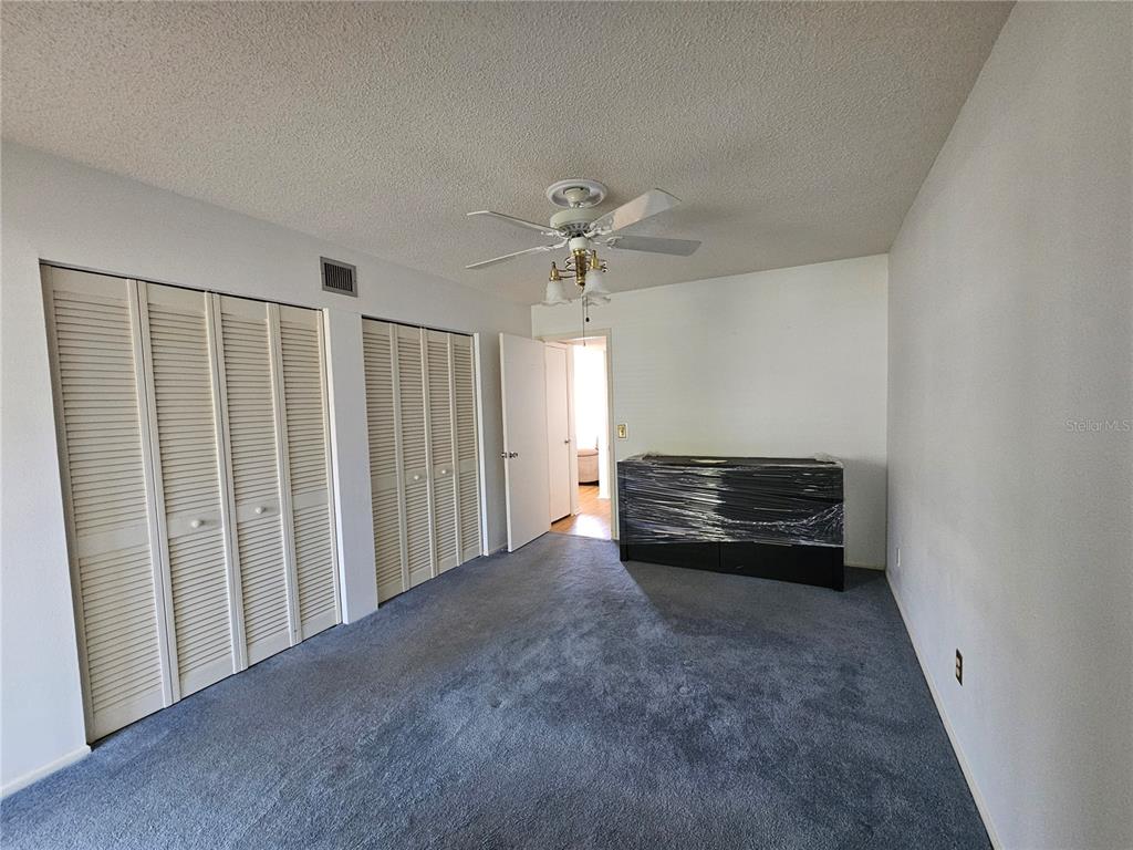 2386 Sumatran Way, Unit 44 Clearwater, FL 33763 - Photo 13 of 67 a view of an empty room with a window