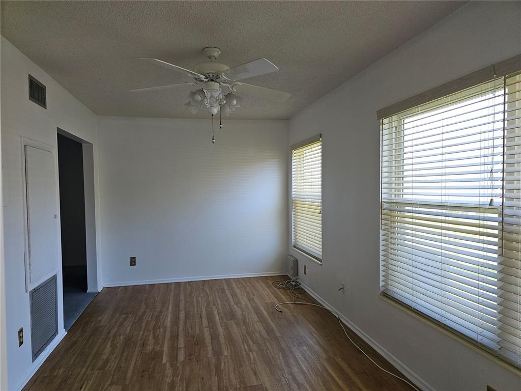 2386 Sumatran Way, Unit 44 Clearwater, FL 33763 - Photo 20 of 67 wooden floor in an empty room with a window