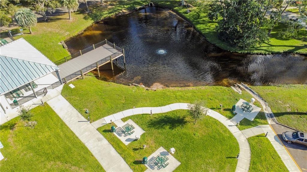 2386 Sumatran Way, Unit 44 Clearwater, FL 33763 - Photo 38 of 67 a view of a swimming pool with a yard