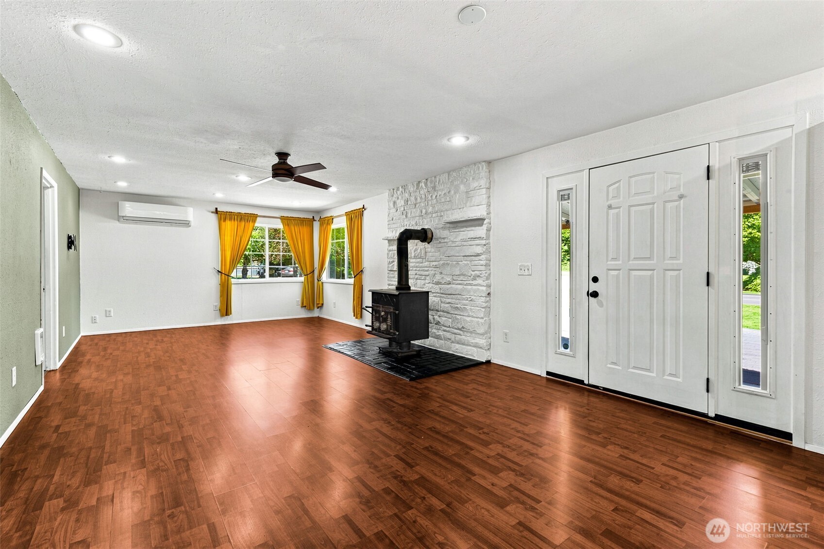 158 Gharet Road Randle, WA 98377 - Photo 8 of 25 an empty room with wooden floor and windows