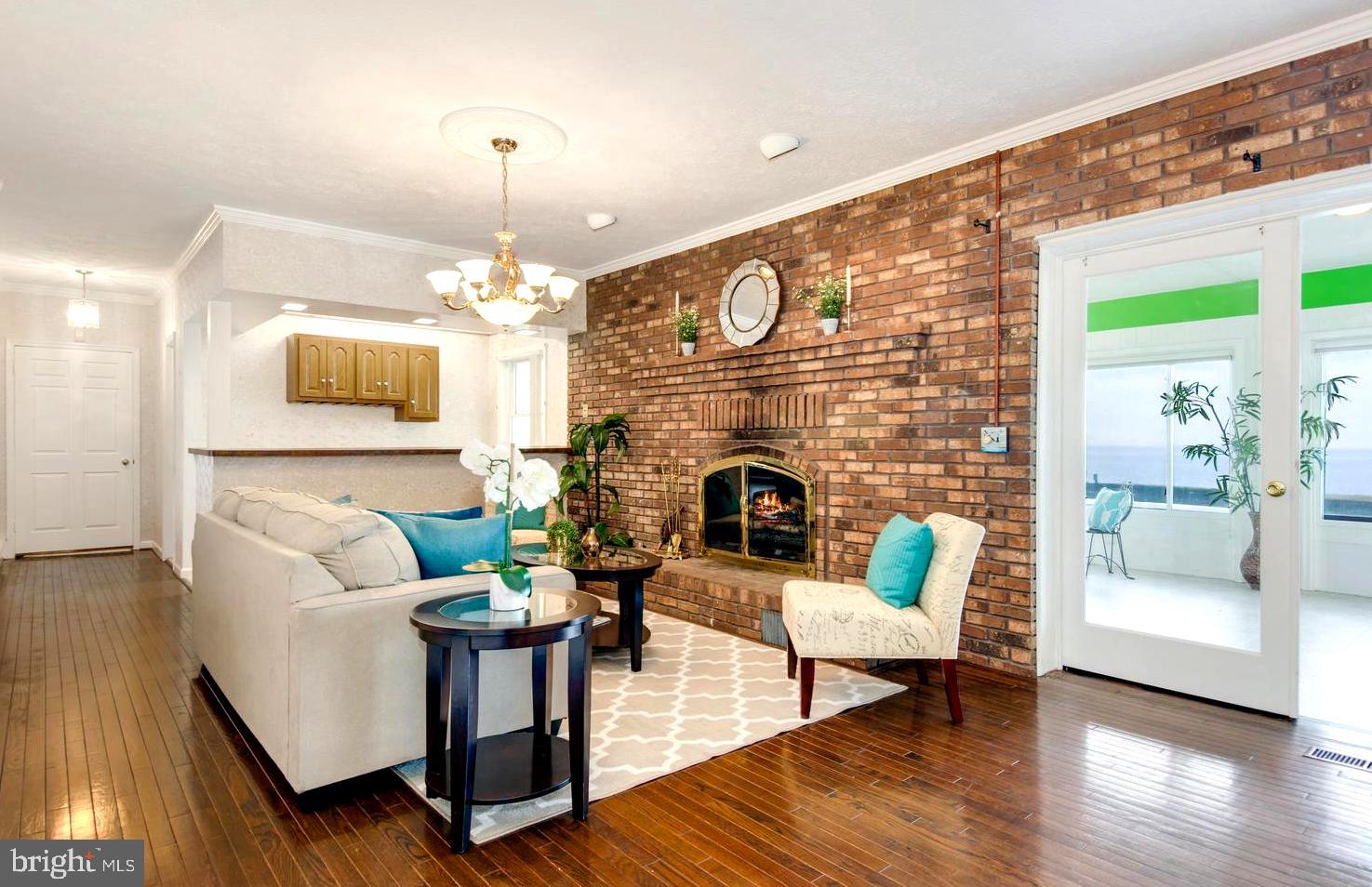 3202 Bennett Point Road Queenstown, MD 21658 - Photo 23 of 49 Adjoining Family Room Sharing Fireplace Ambiance