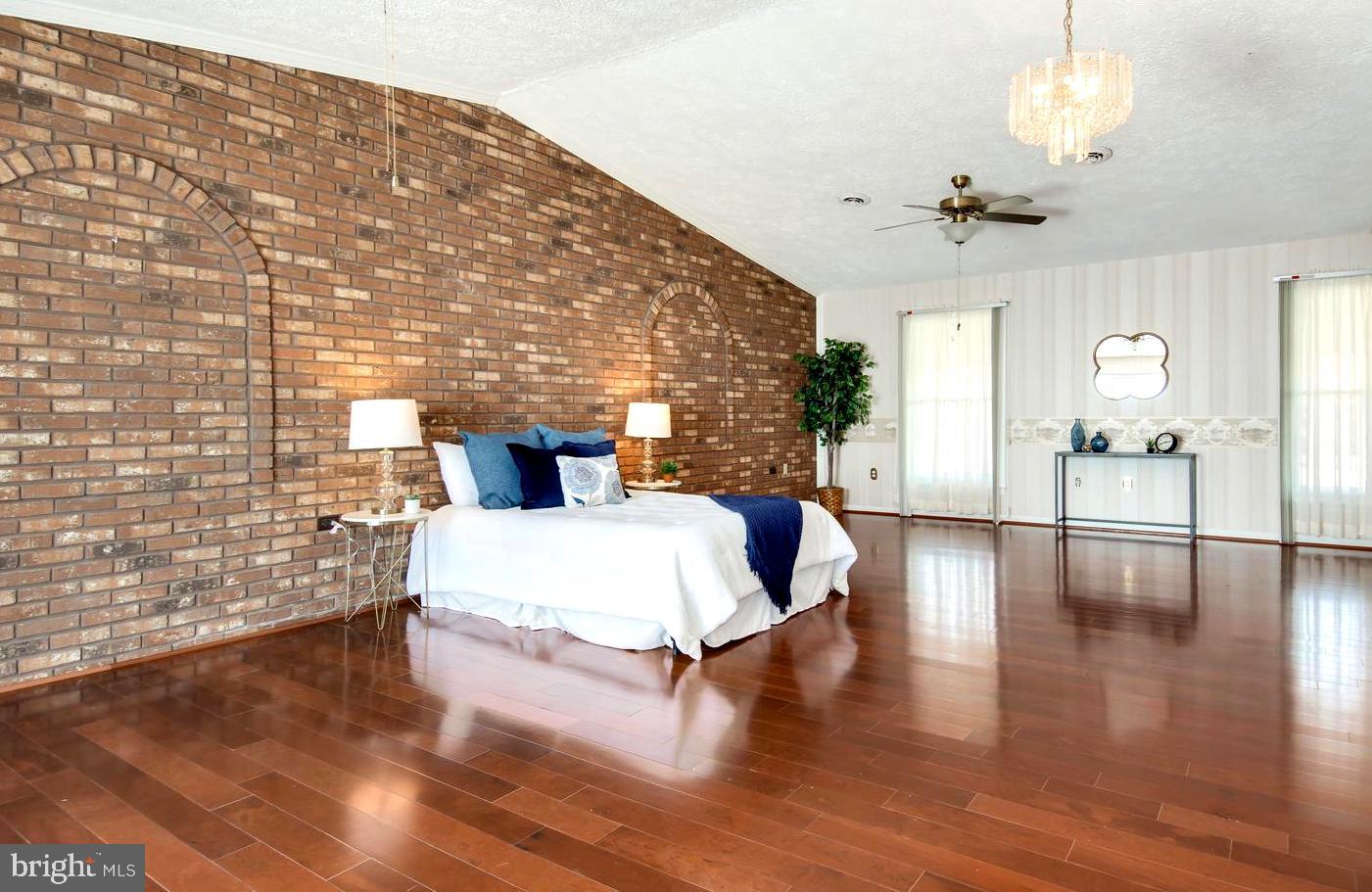 3202 Bennett Point Road Queenstown, MD 21658 - Photo 32 of 49 Expansive Exposed Brick Vaulted Master Suite