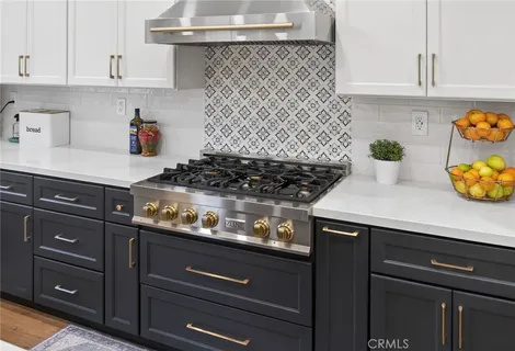 a spacious bedroom with a bed and a flat screen tv