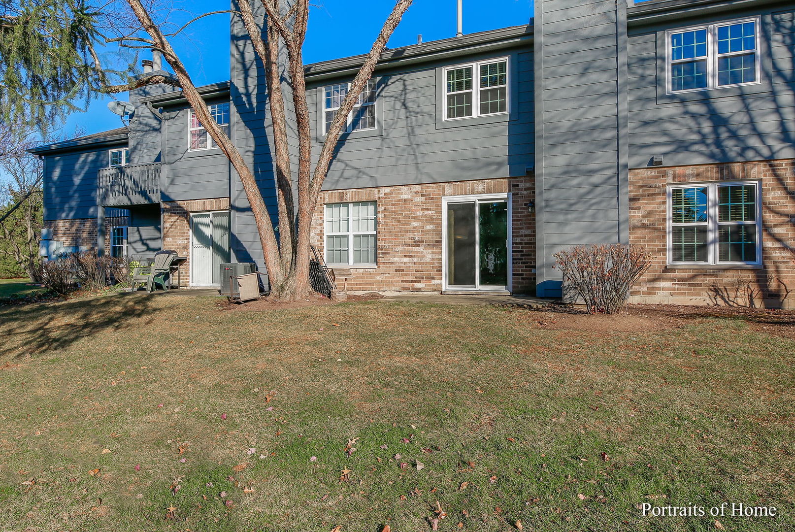 23 Foxcroft Road, Unit 115 Naperville, IL 60565 - Photo 15 of 19 a view of a house with a yard