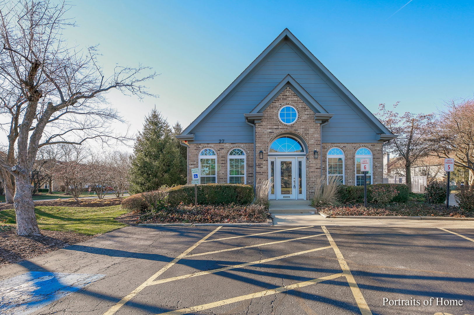 23 Foxcroft Road, Unit 115 Naperville, IL 60565 - Photo 17 of 19 a front view of a house with a yard