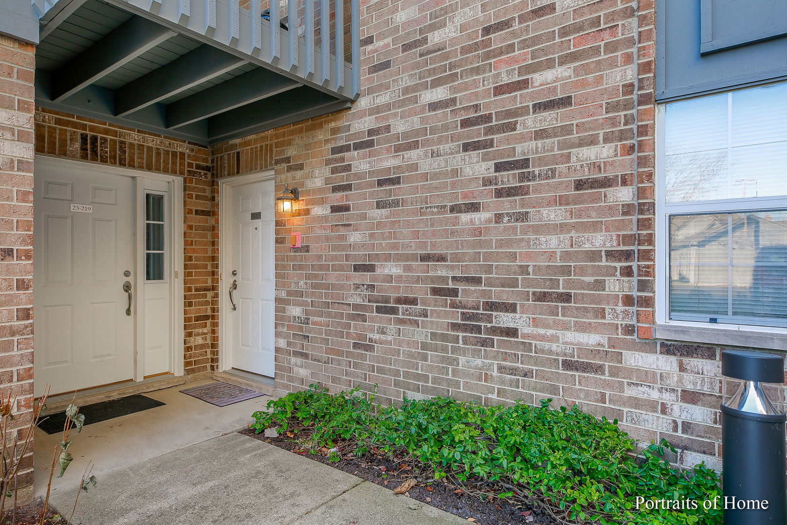 23 Foxcroft Road, Unit 115 Naperville, IL 60565 - Photo 2 of 19 a view of door with brick walls