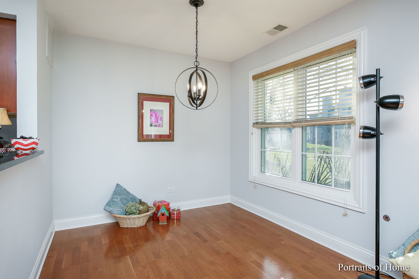23 Foxcroft Road, Unit 115 Naperville, IL 60565 - Photo 5 of 19 a view of an empty room with wooden floor and a window