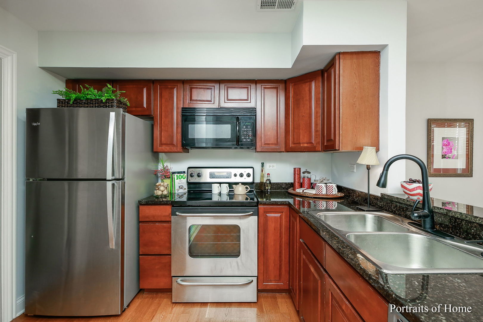 23 Foxcroft Road, Unit 115 Naperville, IL 60565 - Photo 6 of 19 a kitchen with stainless steel appliances granite countertop a refrigerator stove and sink
