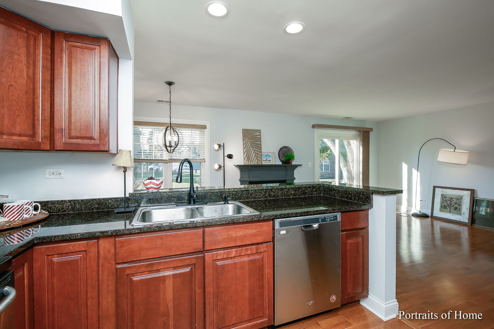 23 Foxcroft Road, Unit 115 Naperville, IL 60565 - Photo 7 of 19 a kitchen with granite countertop a sink and cabinets