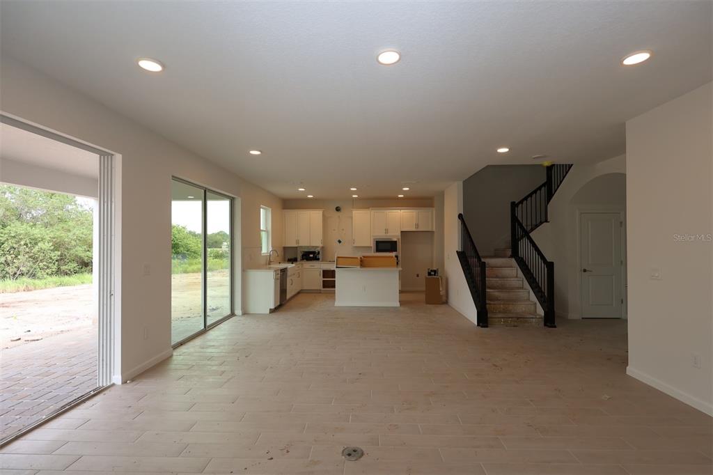 5426 Park Guell Street St. Cloud, FL 34771 - Photo 13 of 64 a big room with entryway table and chairs