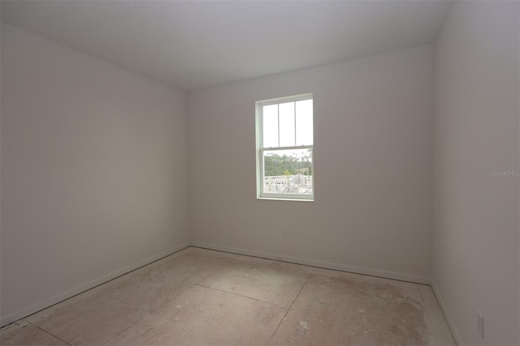 5426 Park Guell Street St. Cloud, FL 34771 - Photo 18 of 64 an empty room with a window