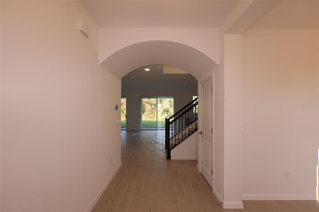 5426 Park Guell Street St. Cloud, FL 34771 - Photo 23 of 64 a view of a hallway to a house with stairs