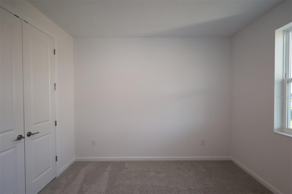 5426 Park Guell Street St. Cloud, FL 34771 - Photo 25 of 64 a room that has a window in it