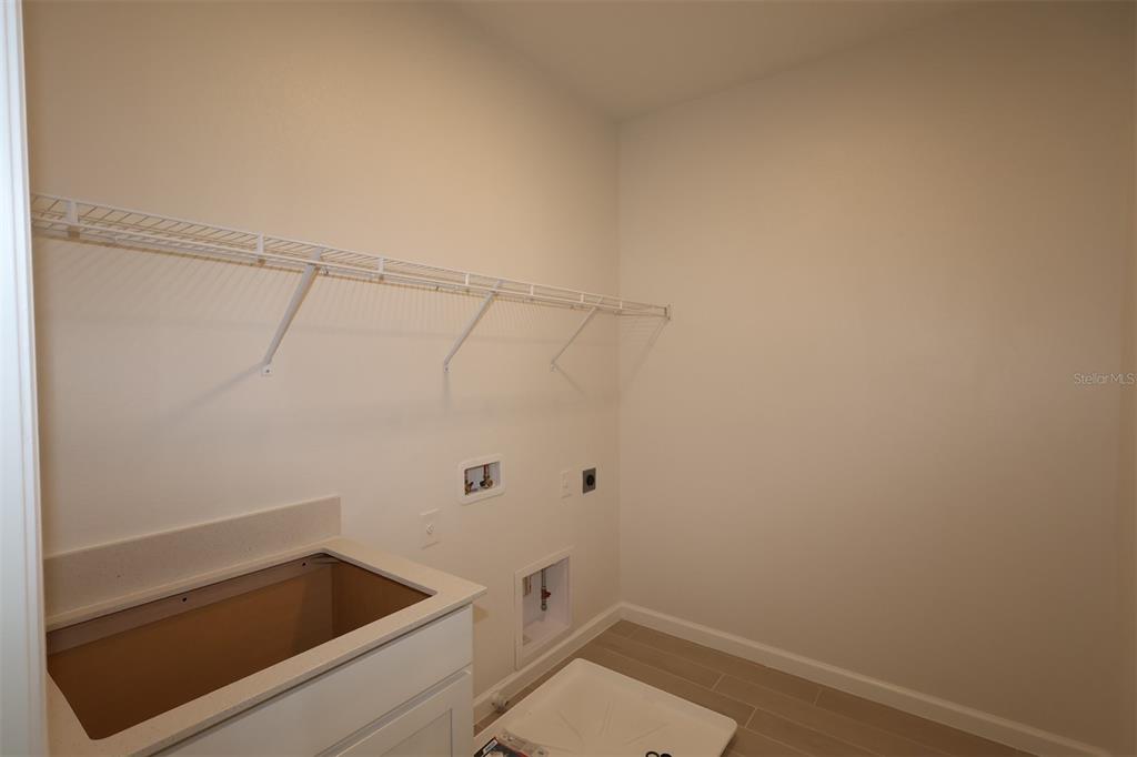 5426 Park Guell Street St. Cloud, FL 34771 - Photo 26 of 64 a bathroom with a sink and vanity