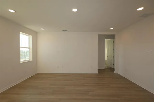 an empty room with windows