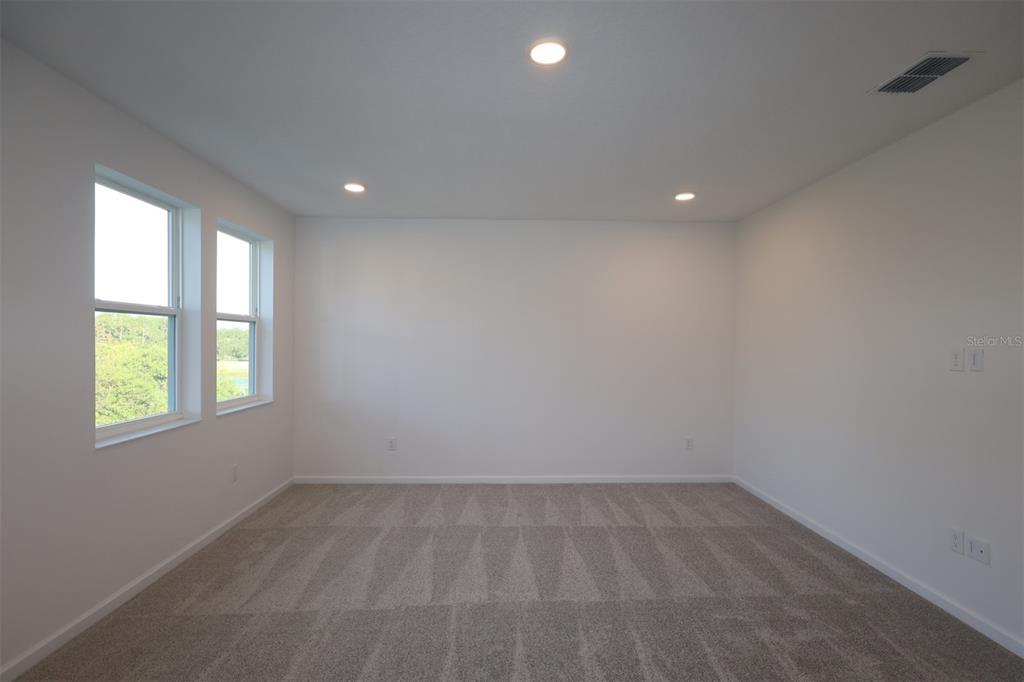 5426 Park Guell Street St. Cloud, FL 34771 - Photo 35 of 64 an empty room with windows