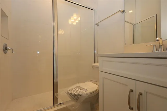 a bathroom with a shower and a toilet