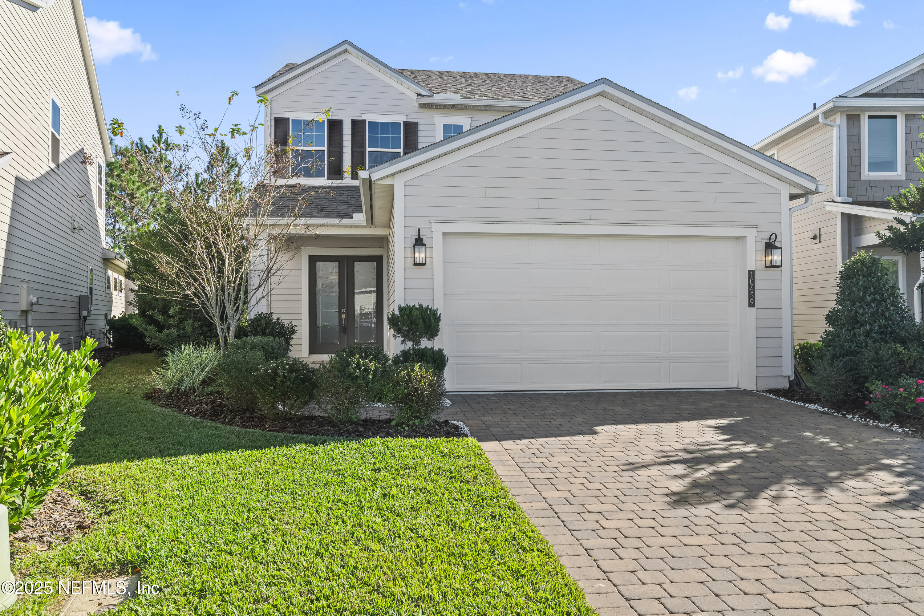 10459 Innovation Way Jacksonville, FL 32256 - Photo 1 of 54 a front view of a house with a garden