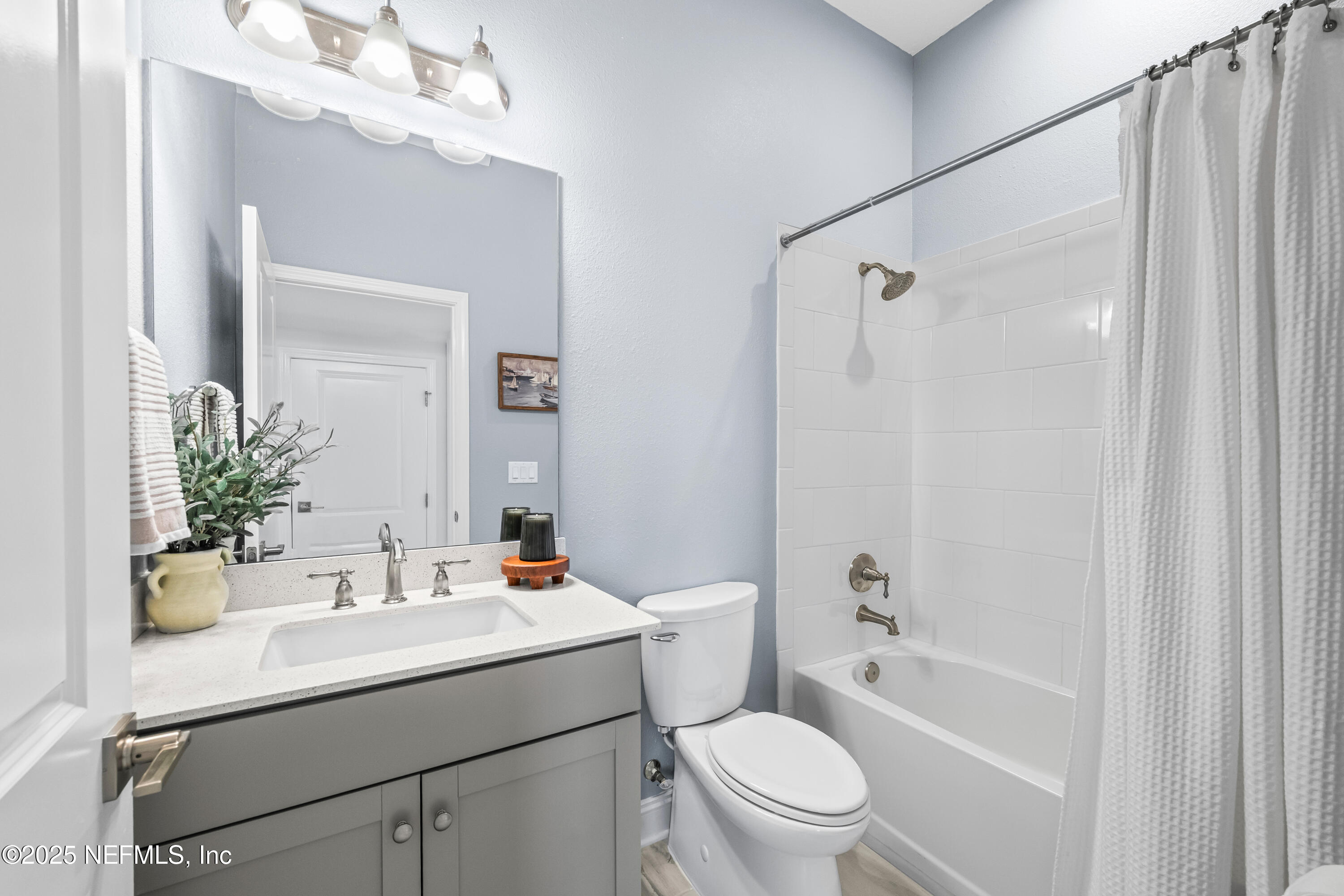 10459 Innovation Way Jacksonville, FL 32256 - Photo 11 of 54 a bathroom with a sink a toilet and shower