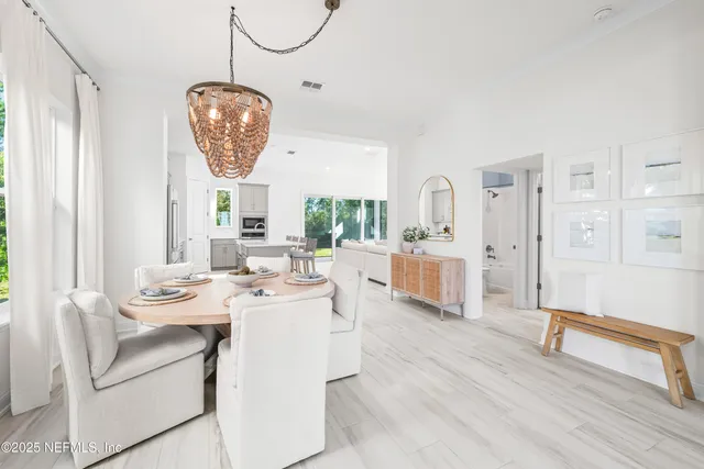 a very nice looking dining room with a table and chairs
