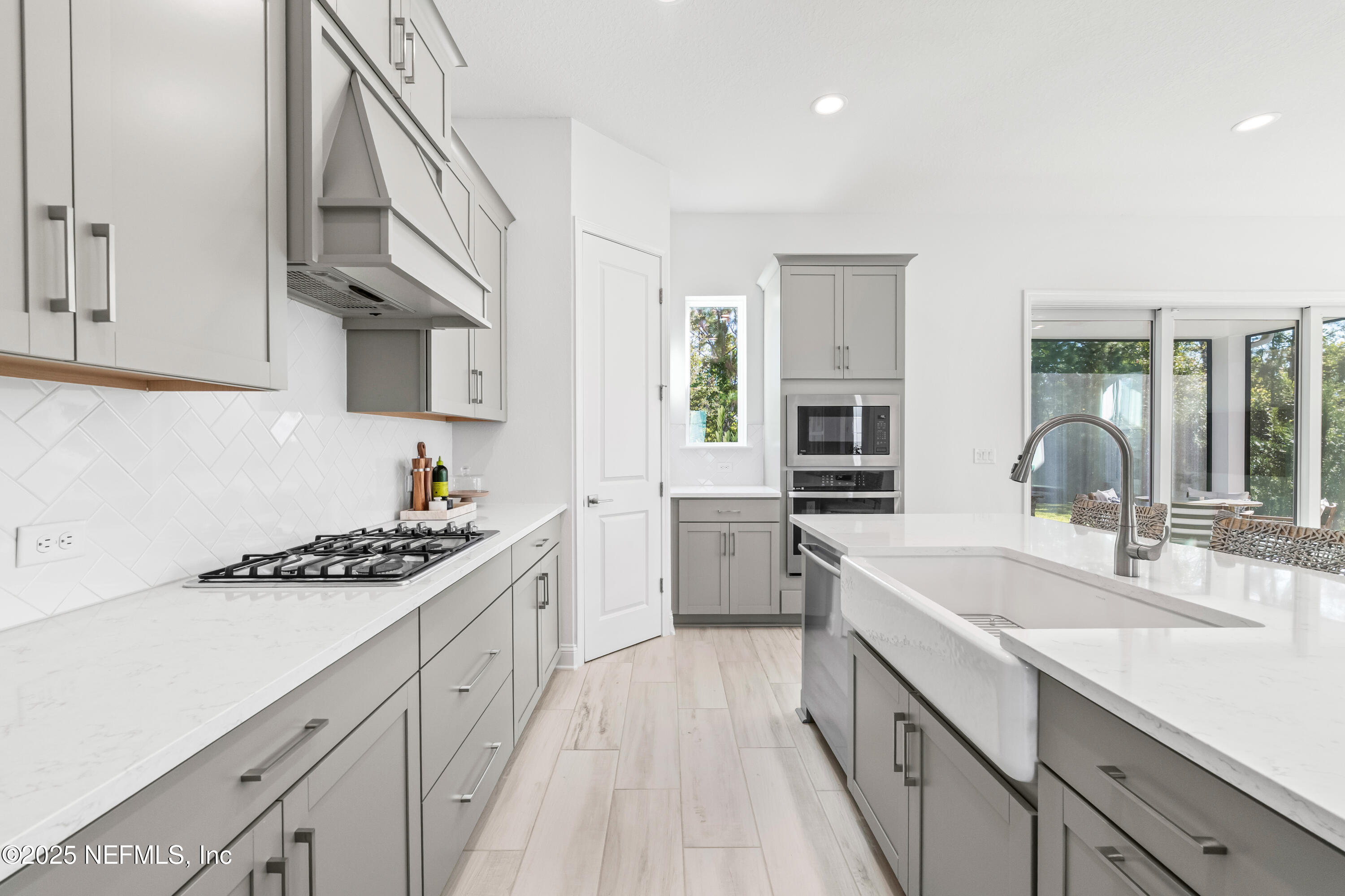 10459 Innovation Way Jacksonville, FL 32256 - Photo 15 of 54 a kitchen with granite countertop a sink stove and cabinets