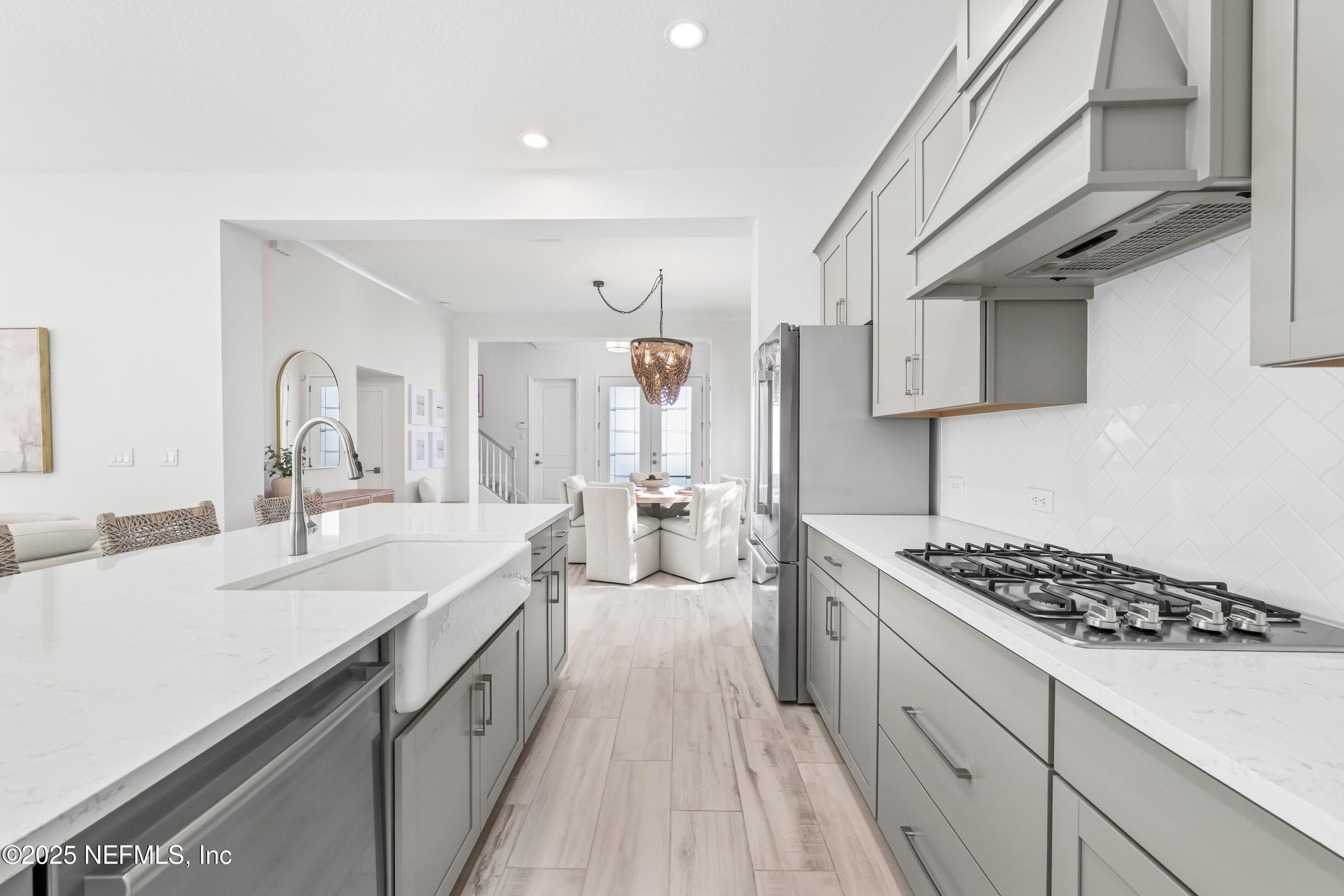 10459 Innovation Way Jacksonville, FL 32256 - Photo 16 of 54 a kitchen with a sink stove and cabinets