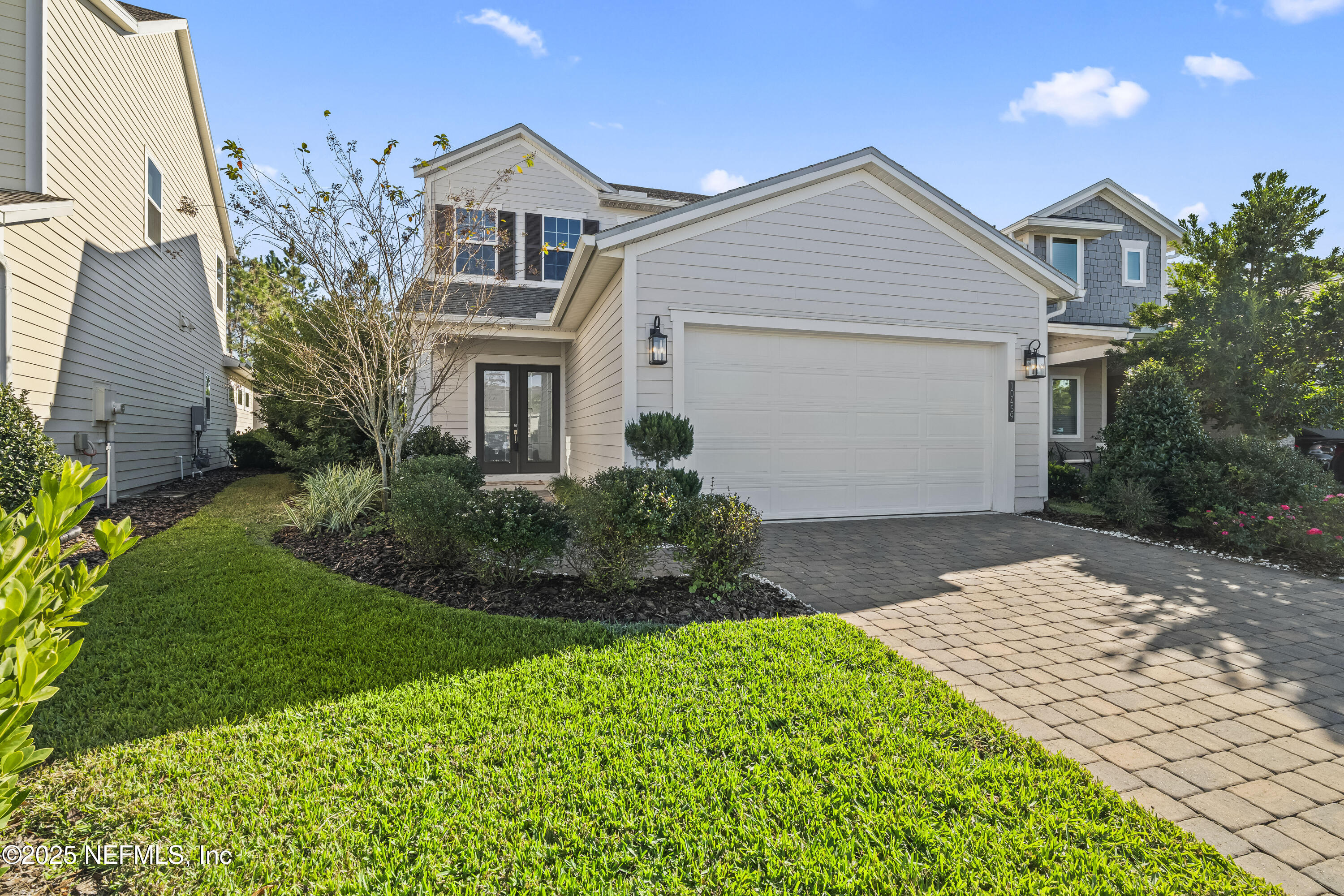 10459 Innovation Way Jacksonville, FL 32256 - Photo 2 of 54 a front view of a house with a yard