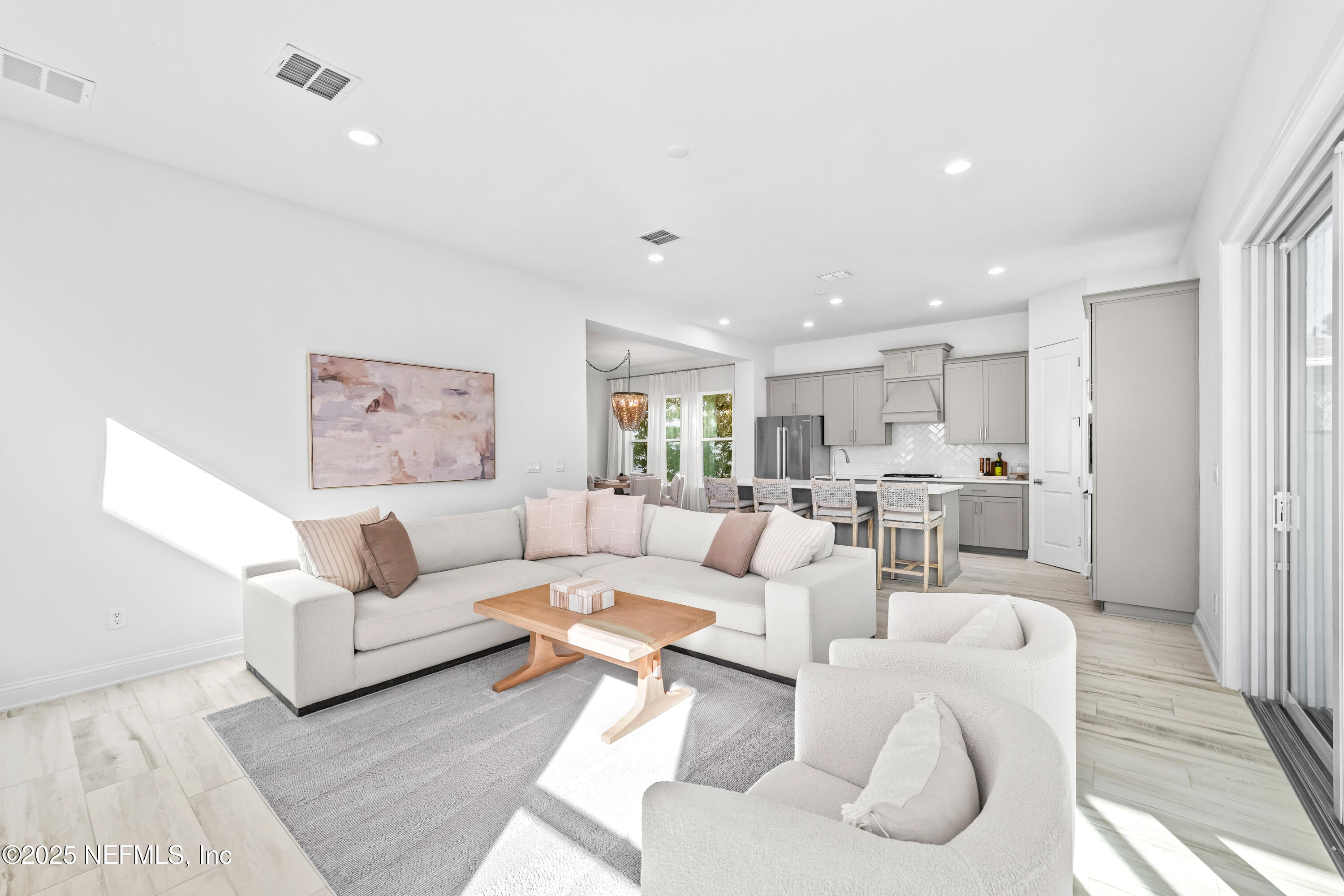 10459 Innovation Way Jacksonville, FL 32256 - Photo 23 of 54 a living room with furniture white walls and white walls