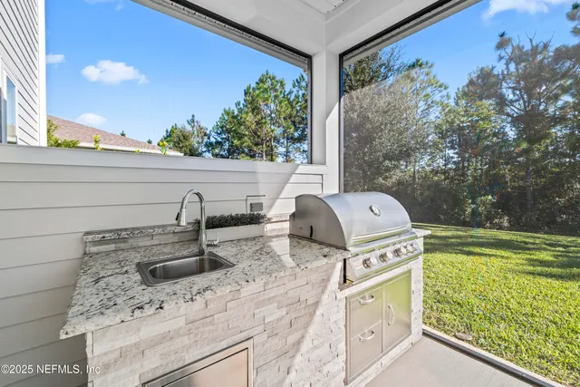 a view of a two chairs in the balcony