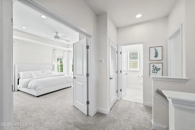 a spacious bedroom with a bed and a couch