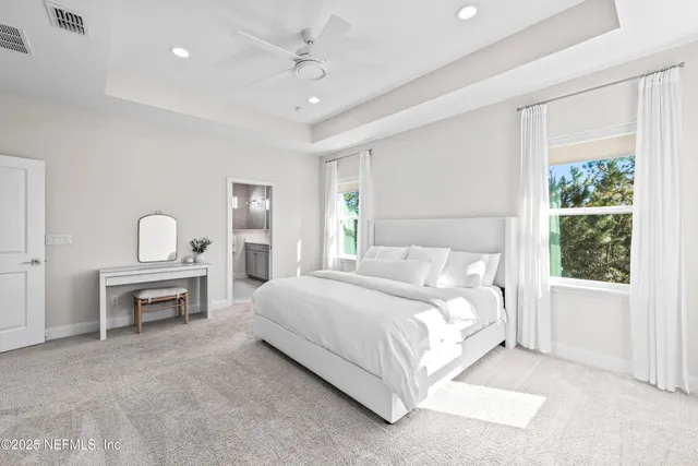 a bed room with a bed and a table