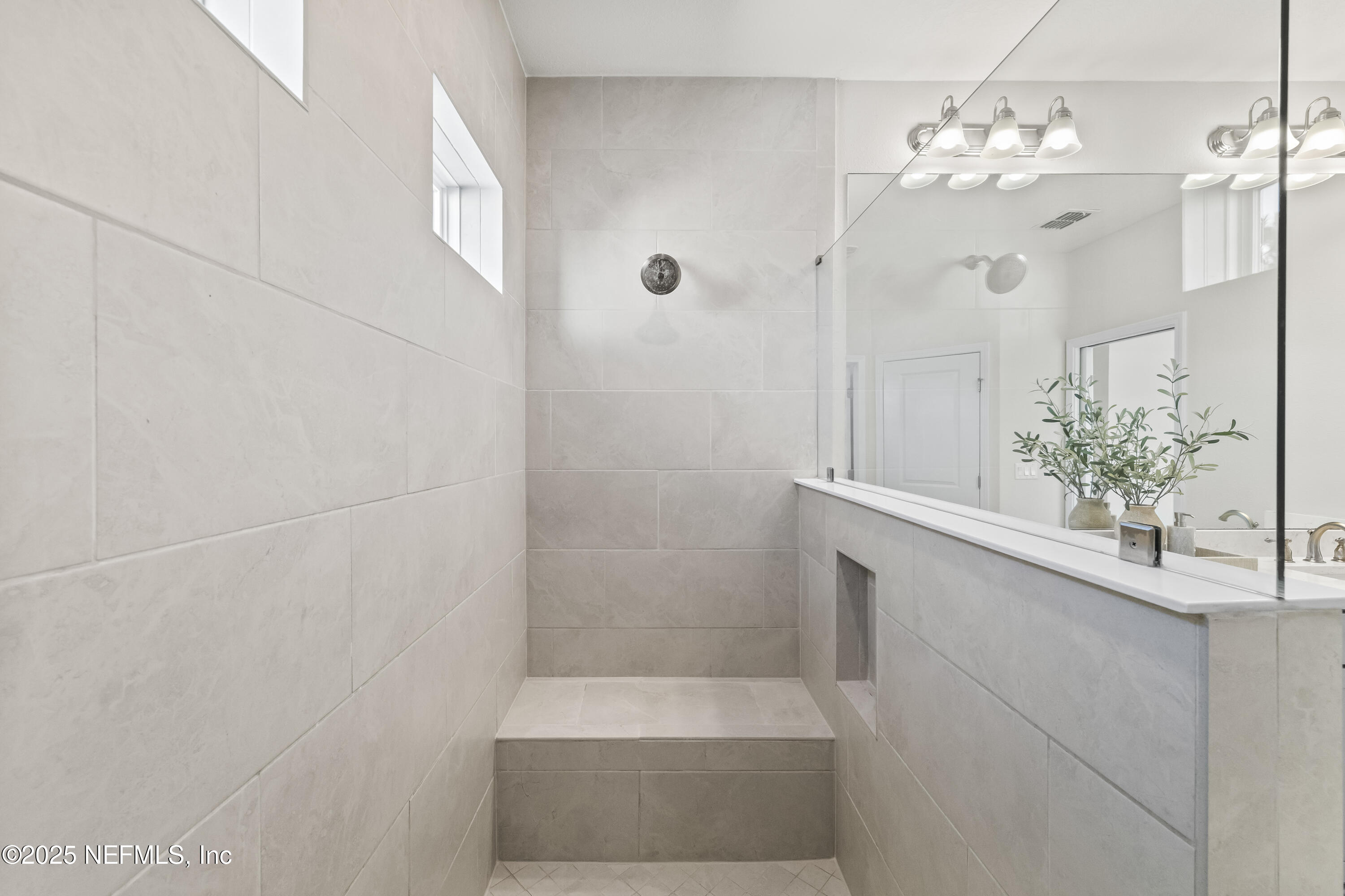 10459 Innovation Way Jacksonville, FL 32256 - Photo 34 of 54 a bathroom with a sink and a mirror