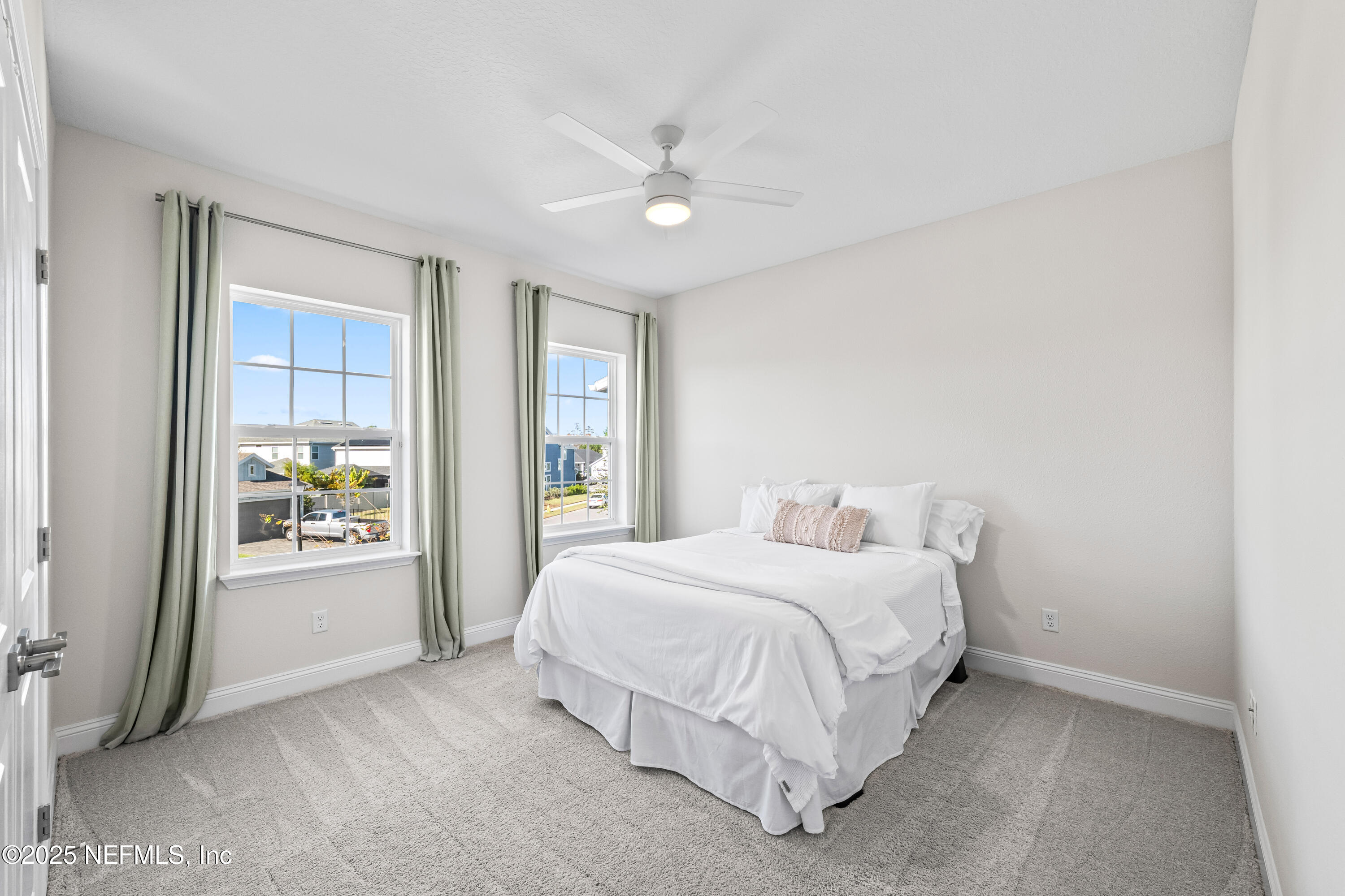 10459 Innovation Way Jacksonville, FL 32256 - Photo 40 of 54 a bedroom with a balcony a bed and a window