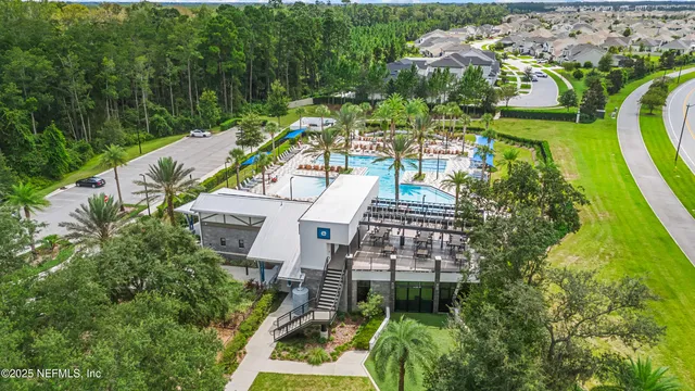 a view of a multi story building with a yard