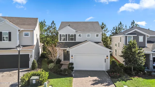 an aerial view of a house with yard swimming pool and outdoor seating