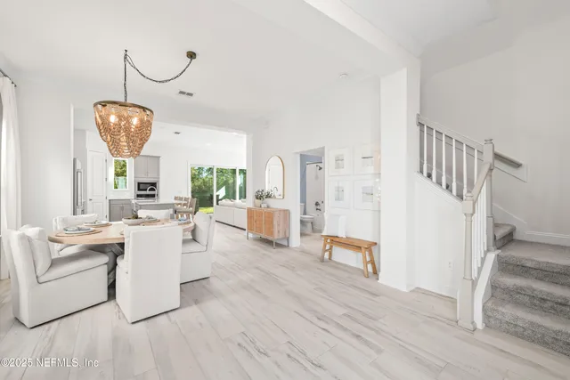 a view of a living room and entryway