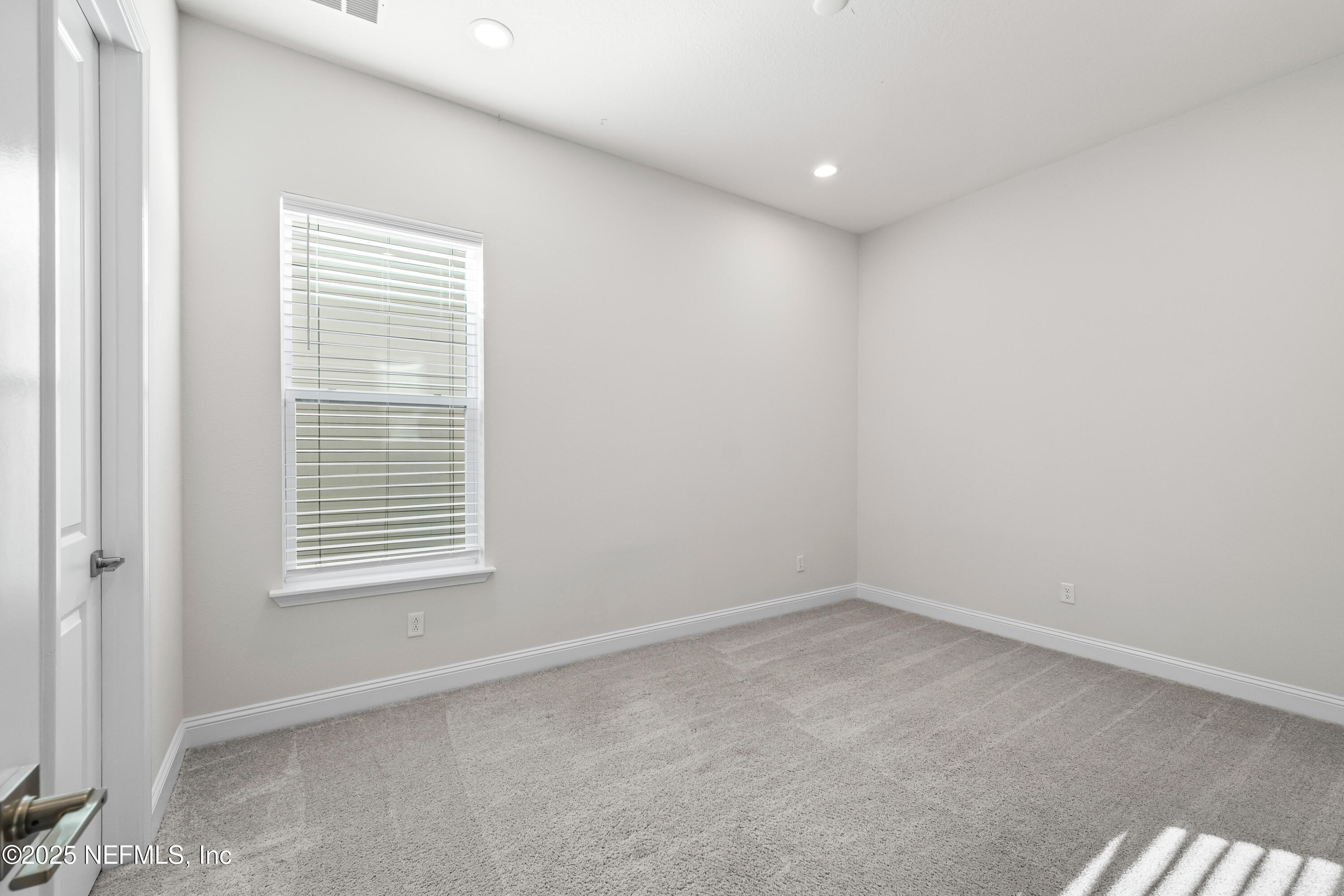 10459 Innovation Way Jacksonville, FL 32256 - Photo 9 of 54 a view of an empty room with a window