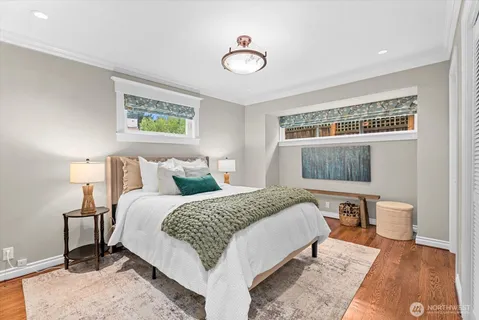 a bedroom with a bed and a desk