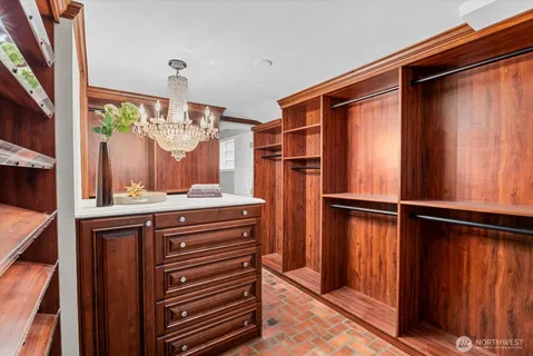 a bathroom with a sink a mirror and a shower