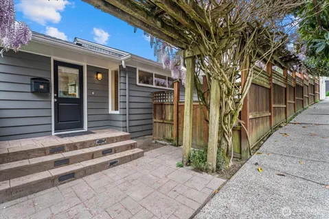 a front view of a house with a small yard