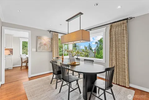 a dining room with furniture window wooden floor